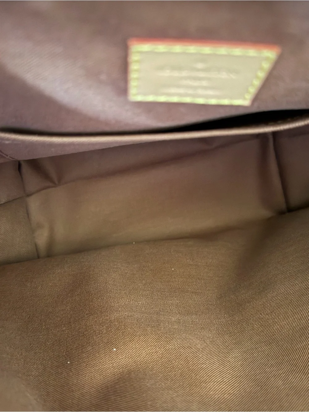 Louis Vuitton Monogram Canvas Backpack with Tan Leather Trim and Pink Charm